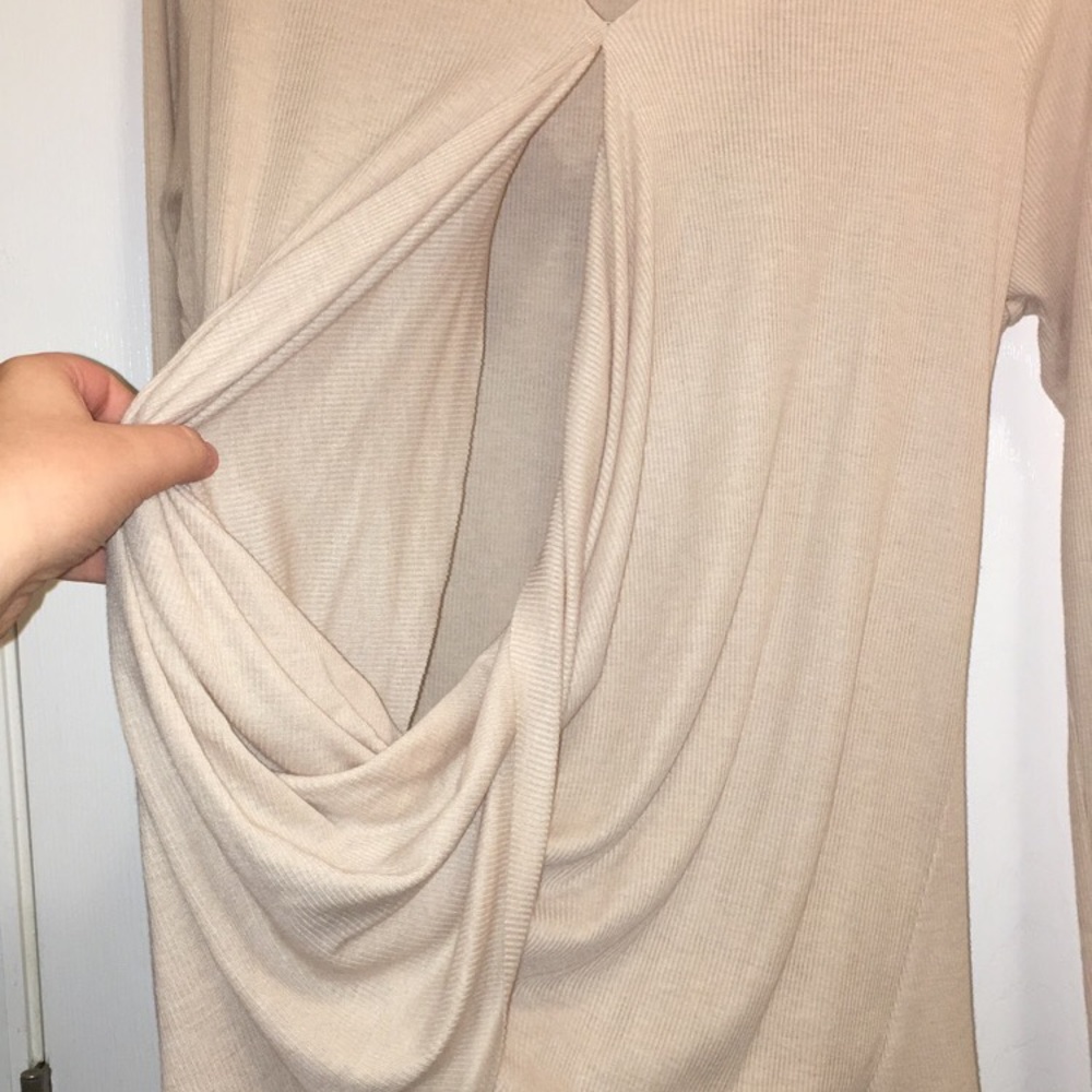 This shirt is spilt down the middle and is tan